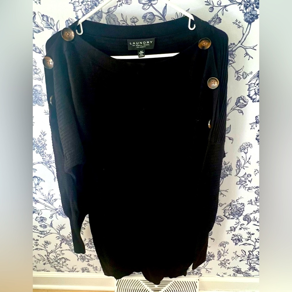 Black Sweatsr Dress hits right below the knees.